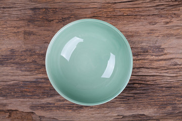 Wall Mural - Empty bowl on wood