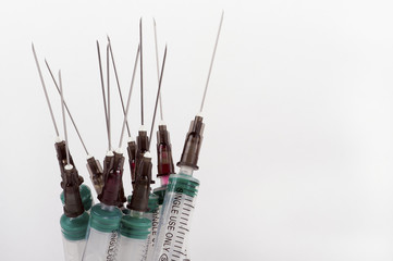 used syringes, closeup, white isolated