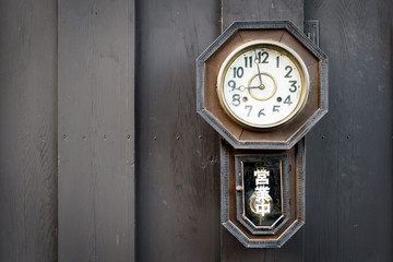 Vintage clock on wood wall