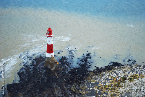 Fotografie, Obraz Lighthouse at the foot of the Beachy Head cliff, UK.
