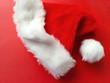 © nebari - Santa Claus hat on red background