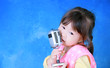 © phaitoon - Happy little girl with retro microphone