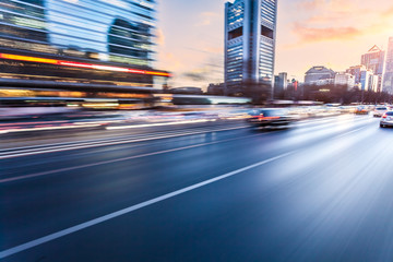 Car driving on freeway at sunset, motion blur