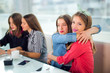 © Mediteraneo - Portrait of four young women sitting at the table in the cafe