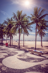 Fototapete - Copacabana with palms and mosaic of sidewalk in Rio de Janeiro. Brazil