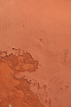 Old Terracotta Painted Stucco Wall With Chipped Paint. Backgroun