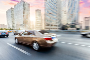 Wall Mural - Car driving on road, motion blur