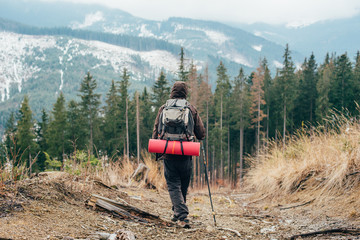 caucasian male hiking in mountains