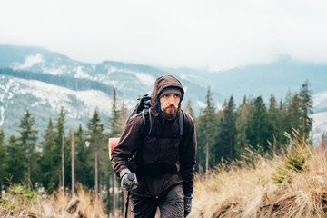 Wall Mural - caucasian male hiking in mountains