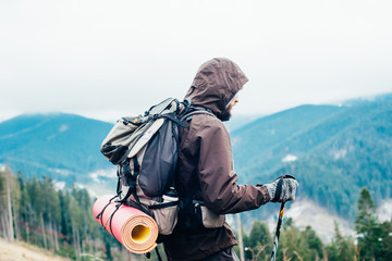 Wall Mural - caucasian male hiking in mountains