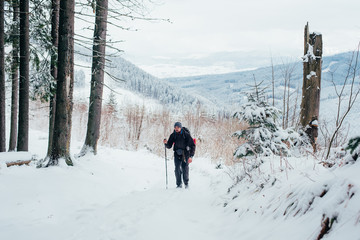 Wall Mural - man hiking in mountains