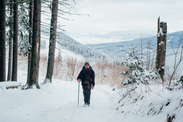 Wall Mural - man hiking in mountains