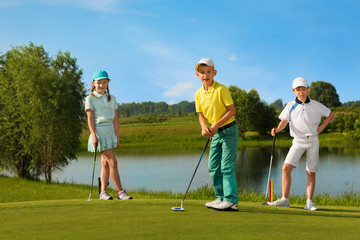 Kids playing golf