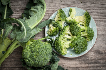 Wall Mural - Full plate raw broccoli rustic wooden table