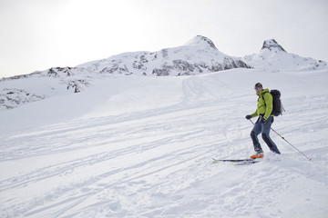 skier braking at the end of the mountain