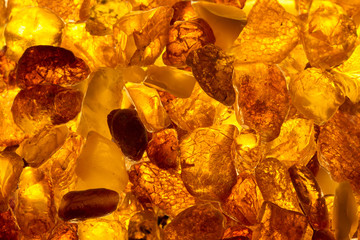 closeup baltic amber stones lie on a flat surface