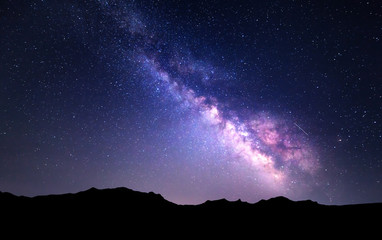 Wall Mural - landscape with milky way. night sky with stars at mountains