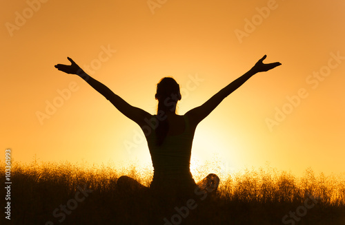 Fotografie, Obraz Happy woman relaxing in a beautiful nature setting.