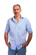 © Viorel Sima - confident mature bald man posing smiling with hands in pockets