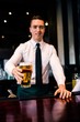 © WavebreakMediaMicro - Barman serving a pint of beer