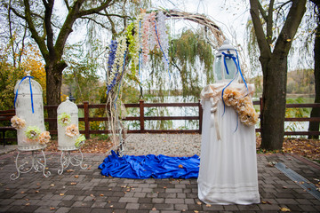 Wall Mural - stylish decorated arch and tables with flowers and ribbons at th