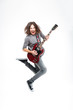 © Drobot Dean - Happy man with long hair jumping and playing electric guitar