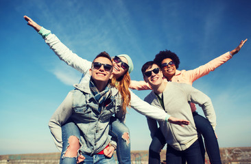Wall Mural - happy friends in shades having fun outdoors