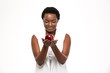© Drobot Dean - Attractive cheerful african woman holding big red apple on palms