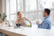 © rastlily - Man and woman coworkers in stylish studio office