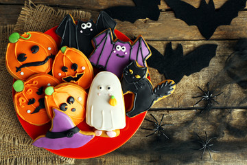 Sticker - Creative Halloween cookies on wooden background