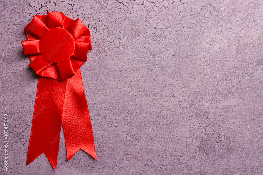 Award ribbon on wooden background