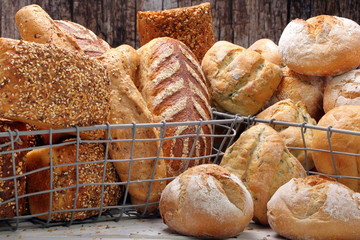 Many different types of bread in metal baskets