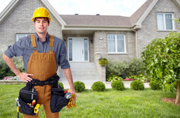 Wall Mural - Builder handyman near new house.