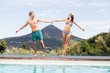 © WavebreakMediaMicro - Young couple enjoying near pool