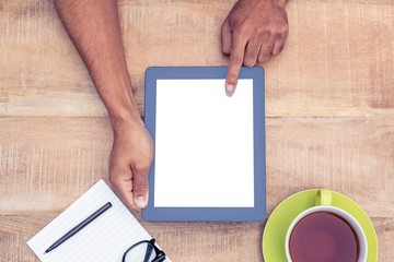 Poster - Cropped image of man using on digital tablet