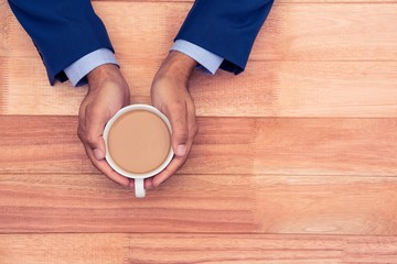 Poster - High angle view of business man holding coffee cup
