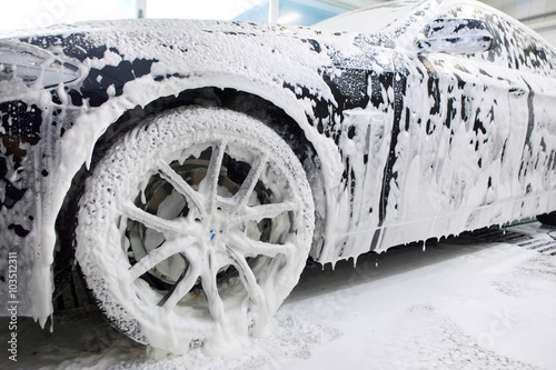 Fotografía Close up detail of wash cleaning brush on car at carwash
