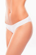 © deagreez - Close up photo of woman's belly and white panties