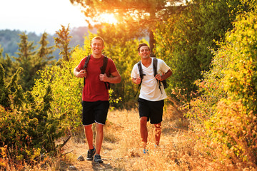 Two backpackers in the summer mountain