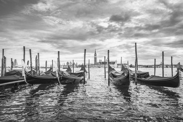 Gondolas in lagoon of Venice and San Giorgio island in background, Italy, Europe, black and white
