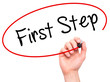 © netsay - Man Hand writing First Step  with black marker on visual screen