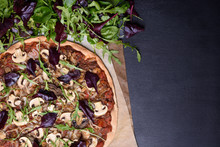 Italian Pizza And Spring Salad Mix With Arugula (rucola) On Dark Wooden Background. Overhead View, Copy Space.