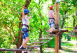 © davit85 - adventure climbing high wire park - people on course in mountain