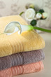 Colorful fresh towels  in a cosy interior with arum lily  close up 
