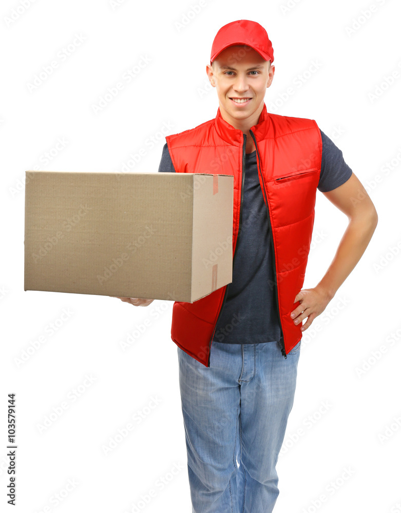 Young handsome delivery man with a carton package, isolated on white