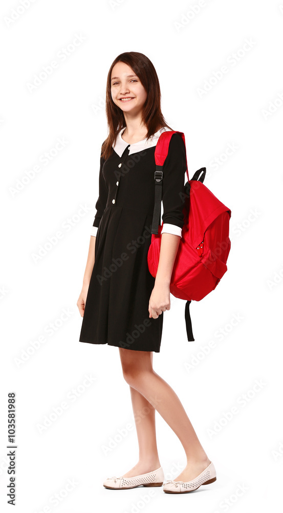 Beautiful schoolgirl with schoolbag isolated on white