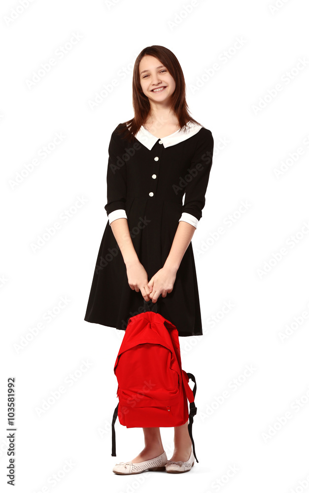 Beautiful schoolgirl with schoolbag isolated on white
