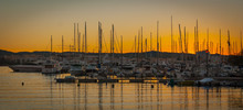 Evening Dramatic Colorful Sunset In The Port Of St Antoni De Portmany, Ibiza, Balearic Islands, Spain.  Boats In Marina At The End Of A Warm Sunny Day In Ibiza, Spain.