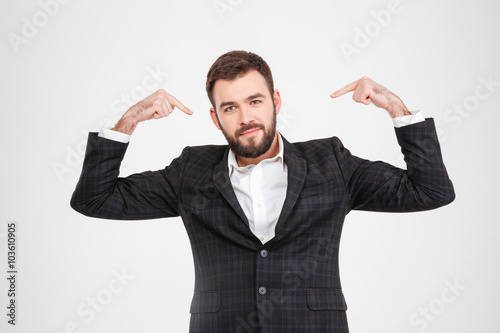 Fotografie, Obraz Proud businessman pointing fingers at herself