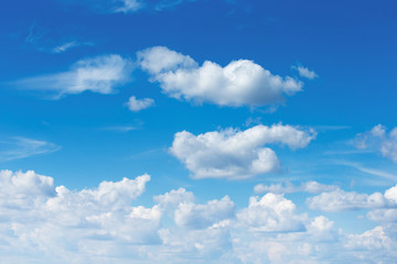 Wall Mural - white fluffy clouds in the blue sky